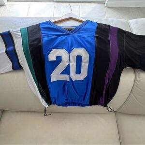 Colorful Striped Jersey with Number 20. Adjustable waist snitch on sides.